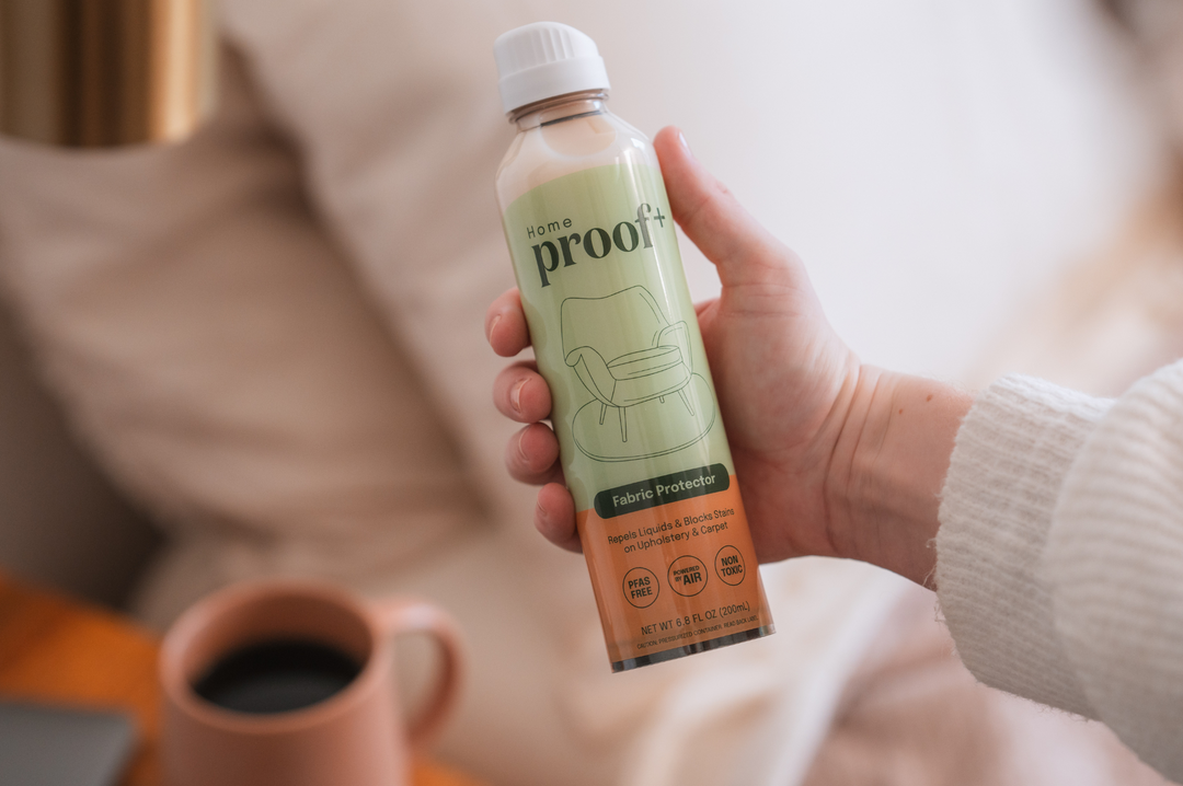 Woman Holding ProofPlus Home Fabric Protector