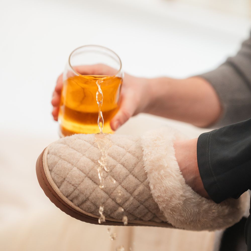 Protected slipper repelling a juice spill
