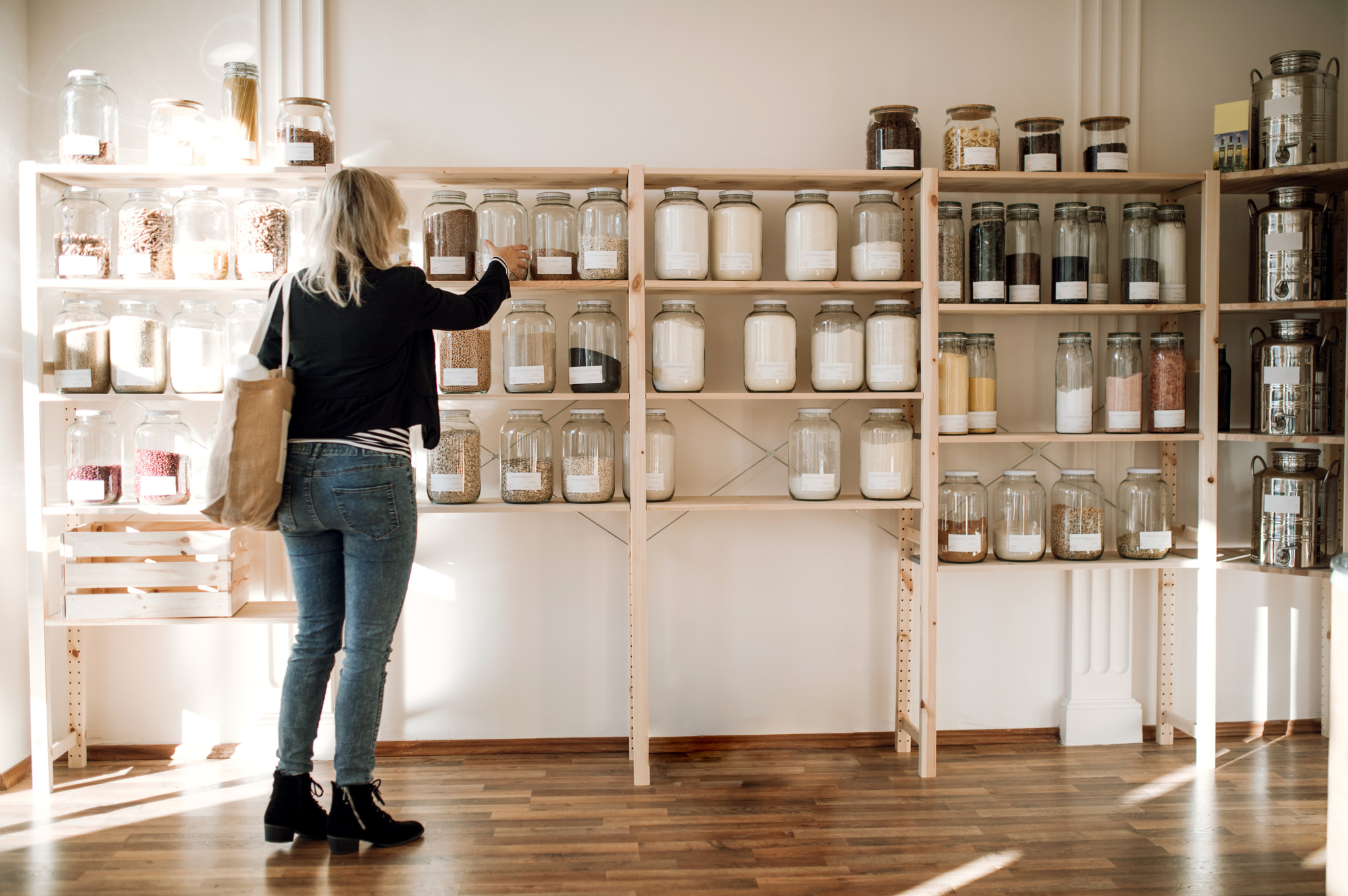 lady at a no waste store choosing a product to purchase