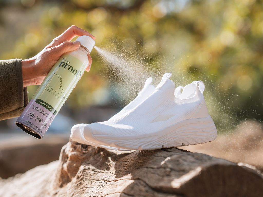 white shoes being sprayed with ProofPlus Shoe Fabric Protector
