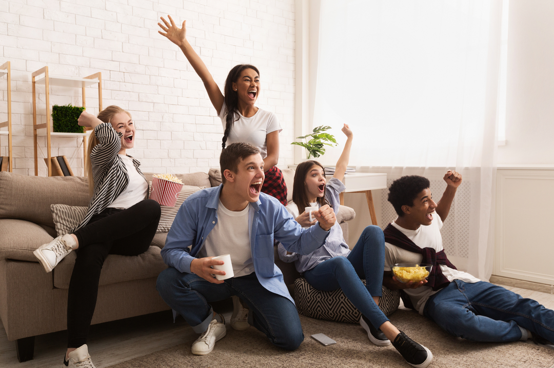 Group of People Excited Watching TV