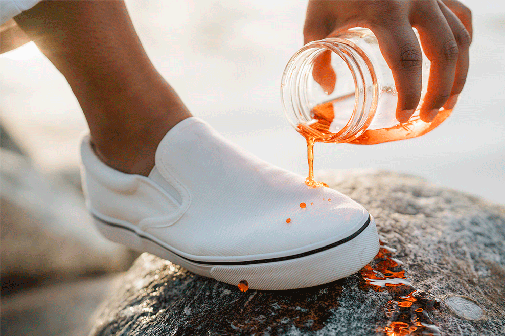 orange liquid beading off a protected white shoe