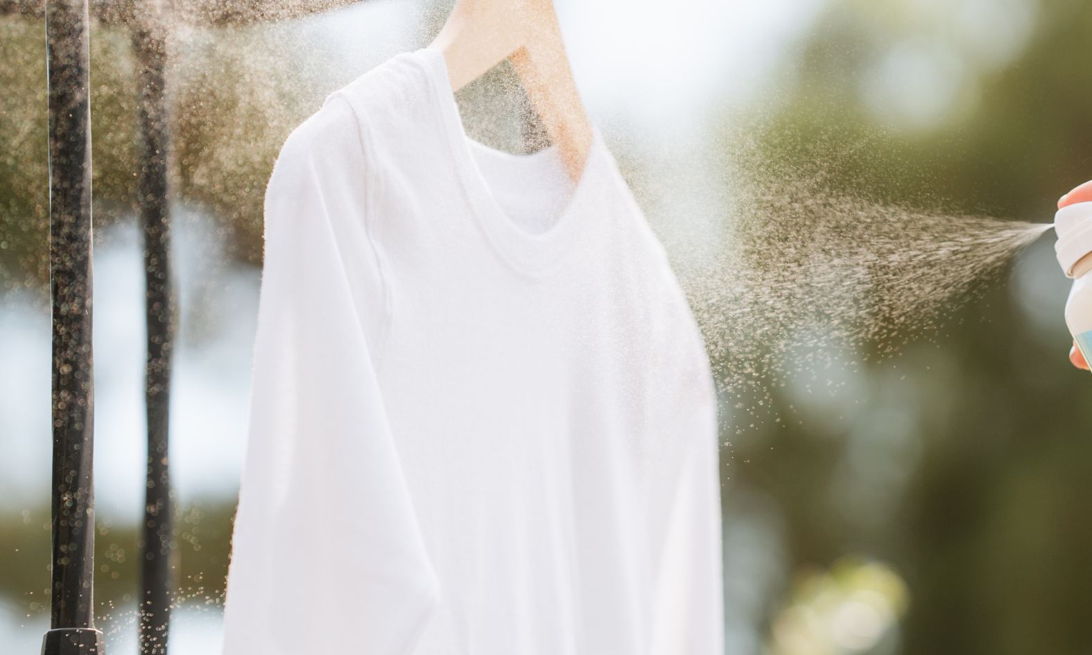 white shirt being sprayed by ProofPlus Clothing Fabric Protector